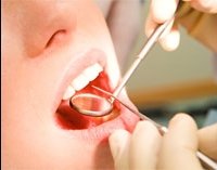 Осмотр зубов у стоматолога